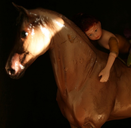 Surreal photo of a doll on a horse