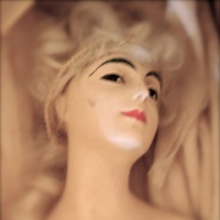 Surreal photo of a doll\'s head